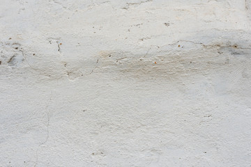 Wall fragment with scratches and cracks