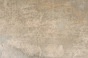 Wall fragment with scratches and cracks