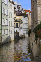 Fototapeta na wymiar Prague. Czech Republic. Bridge over the canal and old houses.