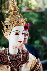 Traditional Thai puppet doll with elegant costume and head ornament
