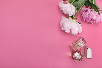 bottle of perfume and peony flowers