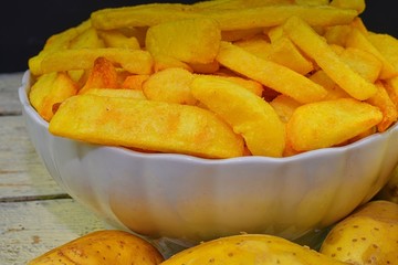 Baked fried potatoes. Potatoes and french fries