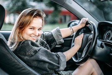 beautiful young girl driver smiling. 
