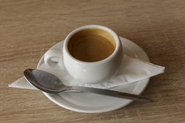 Delicious cup of espresso coffee for a business break. Nobody, isolated.
