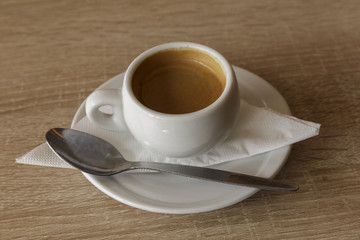 Delicious cup of espresso coffee for a business break. Nobody, isolated.