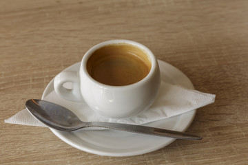 Delicious cup of espresso coffee for a business break. Nobody, isolated.