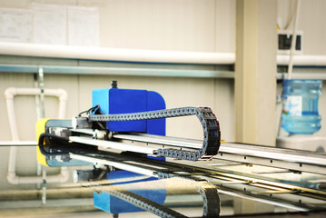 Cutting glass industrial machine in a pvc and aluminium windows and doors factory