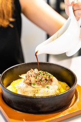 stir-fried beef on rice with egg