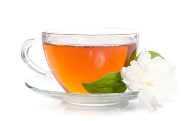 Glass cup of Tea with jasmine flowers and leaves isolated on white background