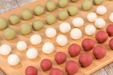 The cooking step of making Japanese Dango dessert with 3 different color in pink(red), white, and green, recipe, hanami Dango, tsukimi Dango, copy space