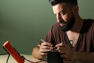 Technician checks the battery in the laboratory