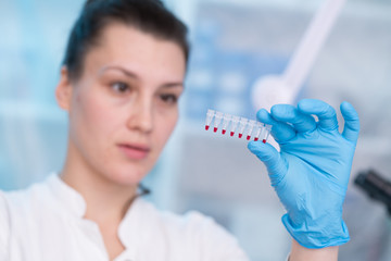 Young woman with genetic research in the laboratory research of cancer diseases