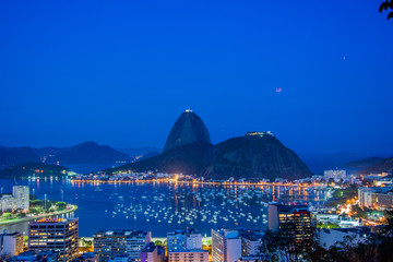 Rio de Janeiro, Brazil - July 27, 2018: The lunar eclipse with the longest 'blood moon' of the century, with the view of Mars, Sugar Loaf Moutain and Guanabara bay also.