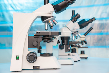 Four microscopes of different designs in the laboratory
