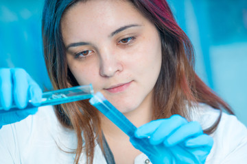 female technician in medical laboratory, hospital Petri dish test
