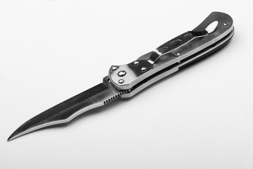 Obraz premium Steel folding knife with an open blade on a white background