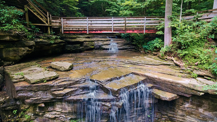 Bridge over Waterfall off Cliffs