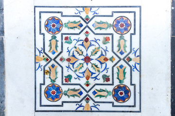 Inlaid marble floor tile forming part of the walkway on an island in Udaipur