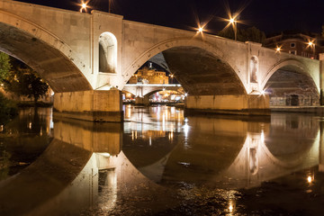 Roma, Bridge on Tiber River with Sant Angelo Castle at Night