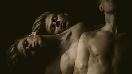 Emotional weird creative male portrait. Multiple exposure. DArk background. tension and anxiety....