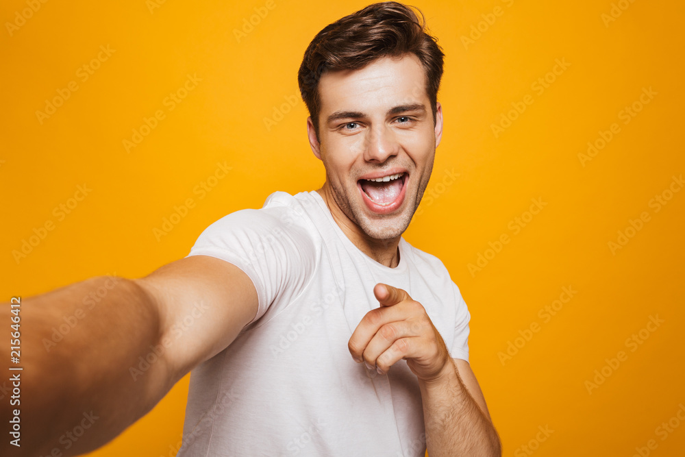 Sticker Portrait of a happy young man taking a selfie