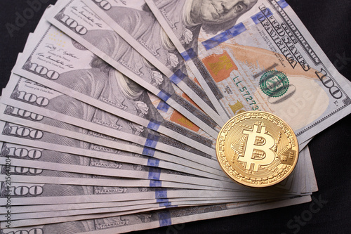 Golden Metal Bitcoin On Dollar Bills Background A Lot Of Money In Golden Metal Bitcoin On Dollar Bills Background A Lot Of Money In Cash 100 Dollars Texture Dear Gold Coin Profit From Mining