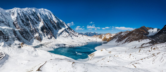 An aerial panoramic view of Tilicho Lake (5,014m), Tilicho Base Camp, Annapurna Circuit Trek, Nepal © Thrithot