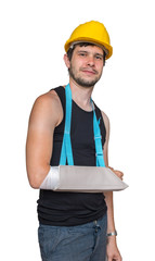 Injured worker is smiling and wearing medical sling on his arm. Isolated on white background.