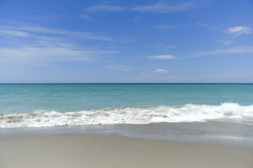 Fototapeta na wymiar Beach, waves and blue sky
