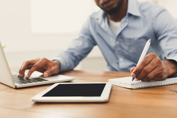 African-american businessman working on tablet