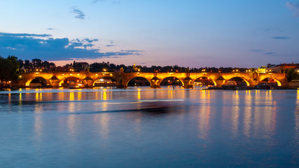 Fototapeta na wymiar Illuminated Charles Bridge reflected in Vltava River by night. Prague, Czech Republic.