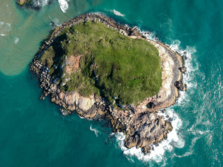  Aerial view (90 degrees) of isolated green island in Brazilian green sea.