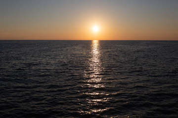 Obraz premium beautiful sunset on the sea hot summer.