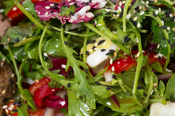 Fresh herbs salad with sesame.