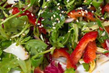 Fresh herbs salad with sesame.