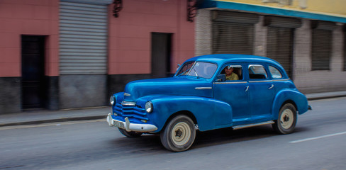 Old American Car Driving through Havana