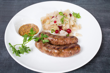 Grilled sausages with sauerkraut.