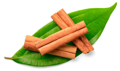 cinnamon sticks with fresh leaves isolatd on the white background, top view