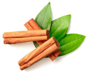 cinnamon sticks with fresh leaves isolatd on the white background, top view