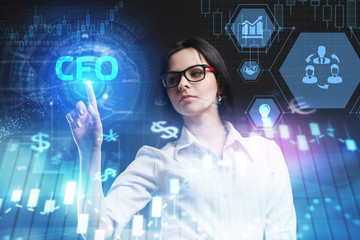 The concept of business, technology, the Internet and the network. A young entrepreneur working on a virtual screen of the future and sees the inscription: CFO