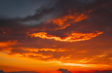 Fototapeta premium Beautiful bright colorful sky. Picture taken at sunset. Red-orange background with nice paints. Rare sunrise. Natural composition