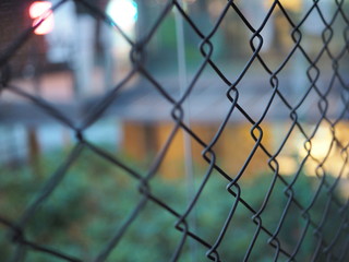 Close up of metal cage, chain link fence