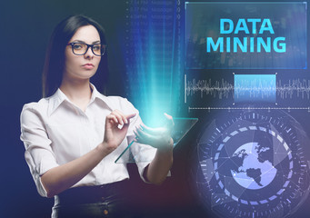 The concept of business, technology, the Internet and the network. A young entrepreneur working on a virtual screen of the future and sees the inscription: Data mining