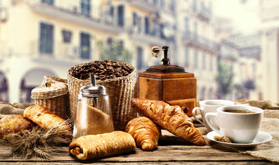 Fresh hot coffee and summer background of city 