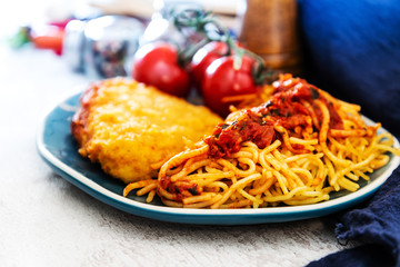 Escalope of spaghetti with tomatoes sauce and basil