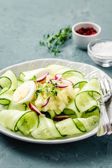 Egg avocado sliced cucumber salad. Selective focus, space for text.