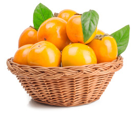 persimmon in basket on white background