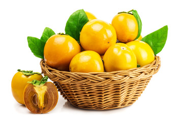 persimmon in basket on white background