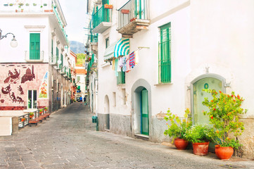 Fototapeta na wymiar narrow european street with ceramic decorations