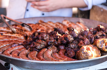 Fried sausages in a metal dish